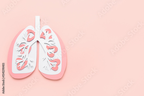 Paper lungs on pink background
