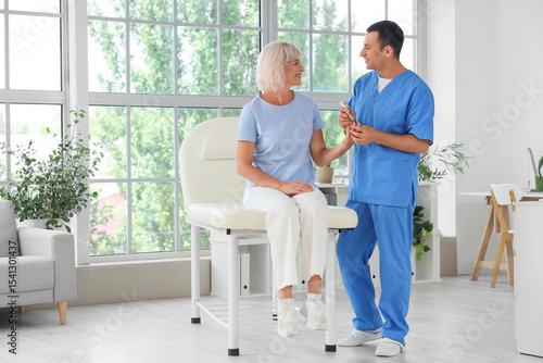 Male endocrinologist with l...