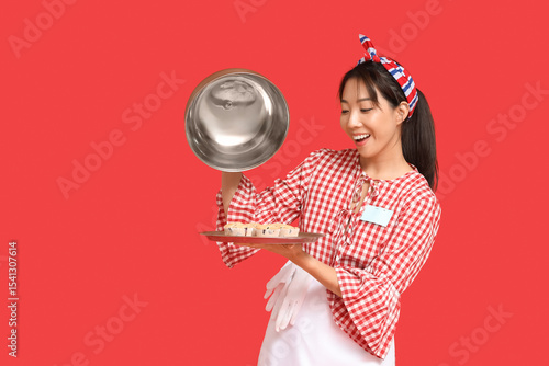 Young Asian smiling waitres...