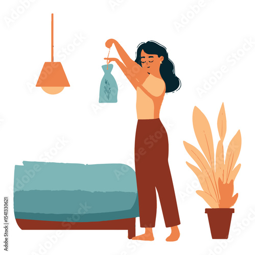 Woman Hanging Decorative Bag in Cozy Bedroom with Potted Plant