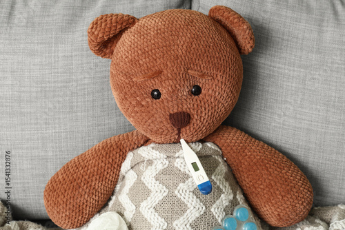 Toy bear with thermometer o...