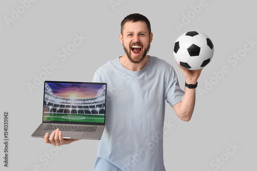 Happy young man with soccer...
