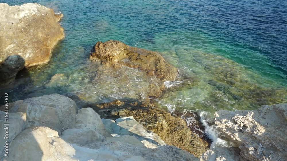 Rocky coastline of Mediterranean sea on Crete, Greece. Blue, clear water. Rocky coastline of Mediterranean sea on Crete, Greece. Blue, clear water.