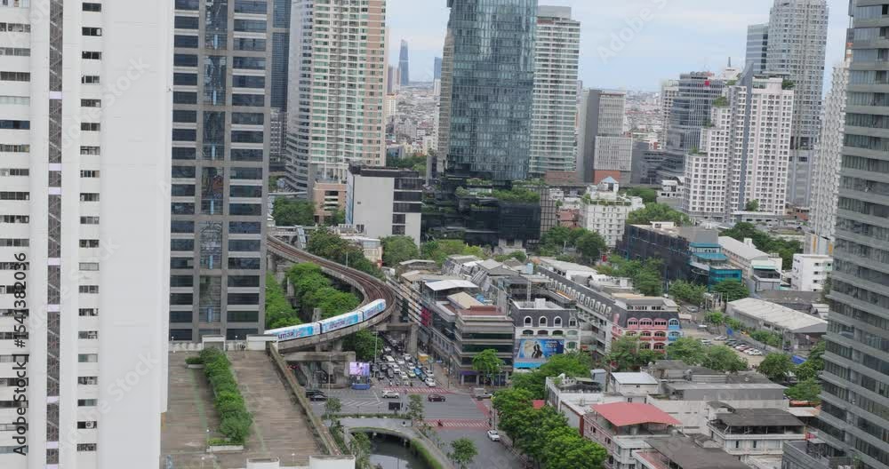 Elevated views of city traffic and the metro MRT train in the Surawong district of Bangkok, Thailand Elevated views of city traffic and the metro MRT train in the Surawong district of Bangkok, Thailand