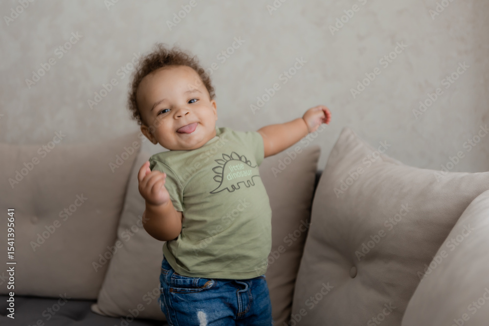 Fototapeta premium portrait of an African-American baby smiling at home