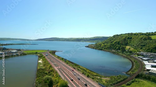 Wallpaper Mural Reversing aerial video of Larne, County Antrim in Northern Ireland, UK on a bright and sunny day. Filmed in 4K, 60FPS and with Rec709 color. Torontodigital.ca