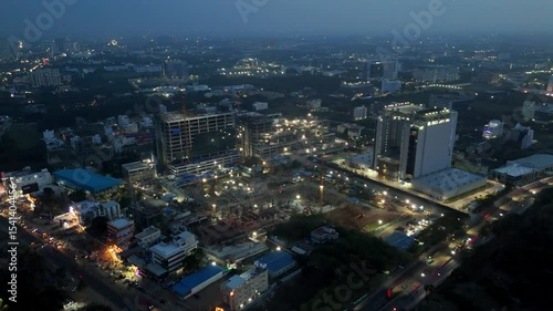 Wallpaper Mural Aerial view of Chennai, India, at night, showing brightly lit construction sites, modern buildings, and a distant tower. It captures a dynamic, developing city after dark. Torontodigital.ca