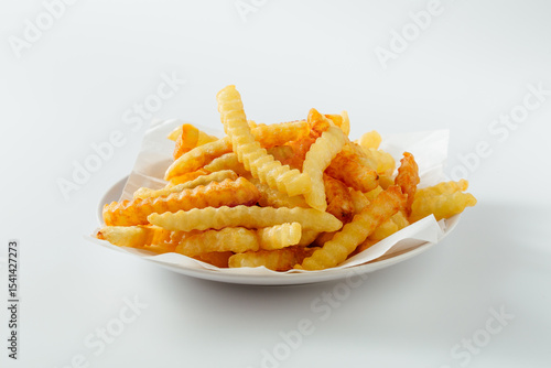 Photography Crispy Golden Crinkle Cut French Fries on White Plate with Napkin