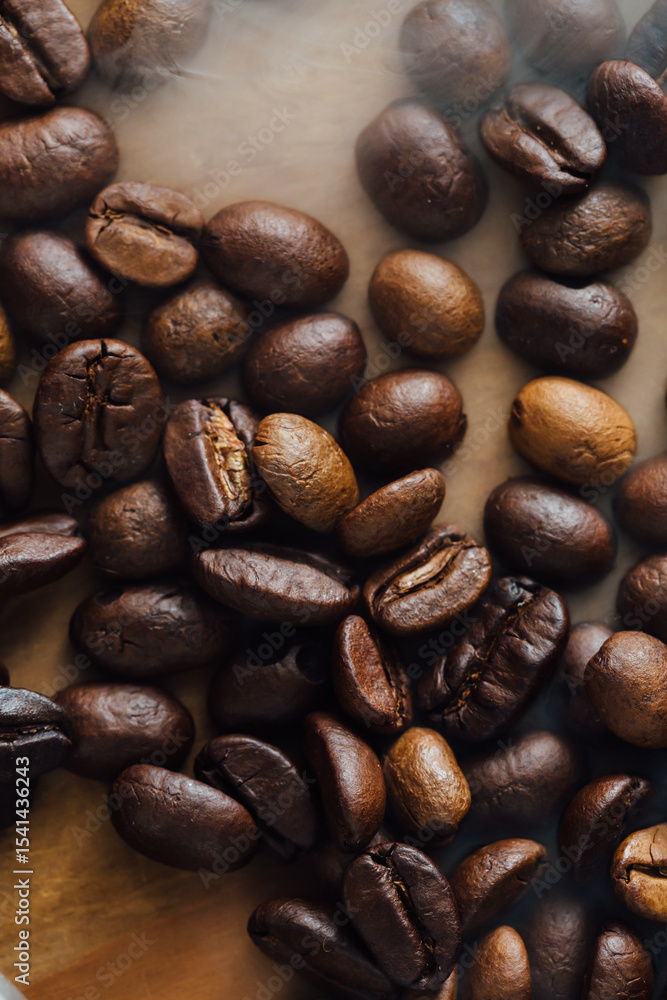 Fototapeta premium Assorted Coffee Beans in Various Shades on Wooden Surface