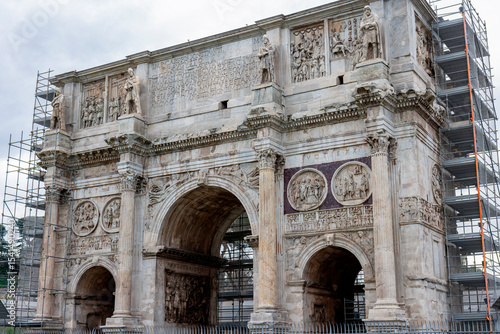 The Arch of Constantine stands near the Colosseum, a majestic Roman triumphal arch celebrating Emperor Constantine’s victory