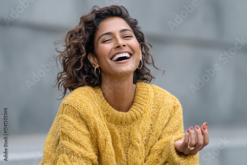 close up of young indian woman laughing