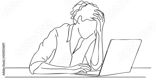 Frustrated person working on laptop while dealing with stress in a simple workspace