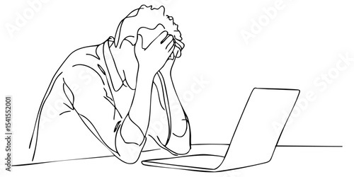 Frustrated person with head in hands at desk with laptop during working hours