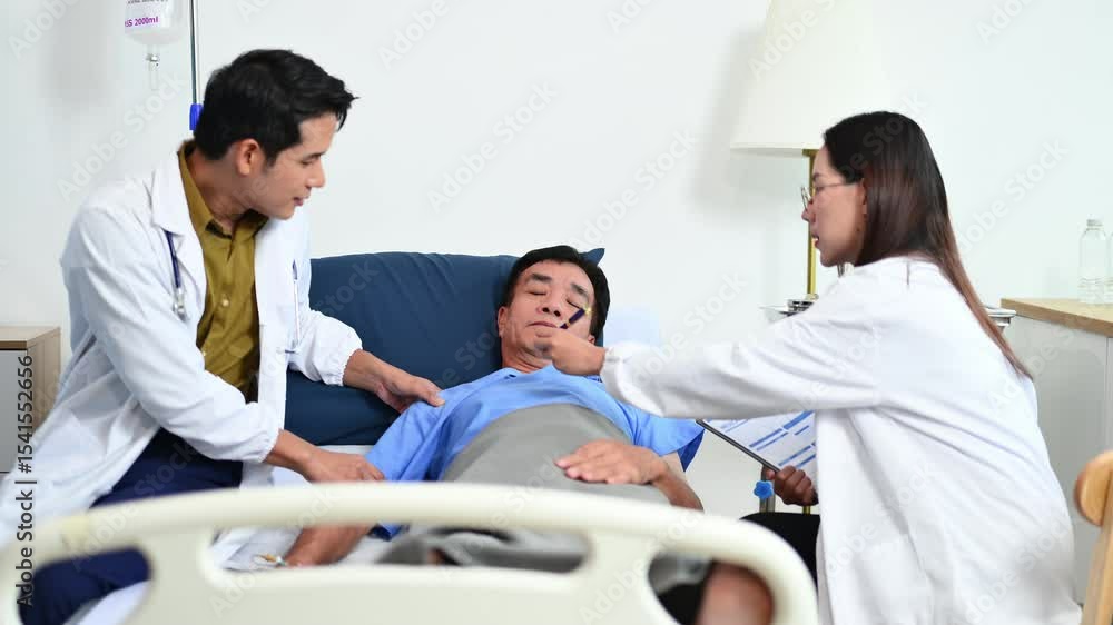 Medical professional helps patient with arm movement therapy during bedside exam. Great for rehabilitation, recovery, hospital care Medical professional helps patient with arm movement therapy during bedside exam. Great for rehabilitation, recovery, hospital care