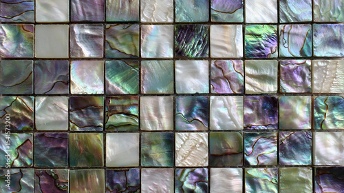 Square abalone shell. The color tone changes from green to purple with an iridescent effect. Each tile has unique colors and textures that resemble natural gemstones.