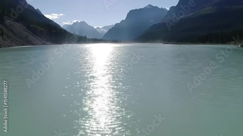 Mountain lake reflecting sunlight