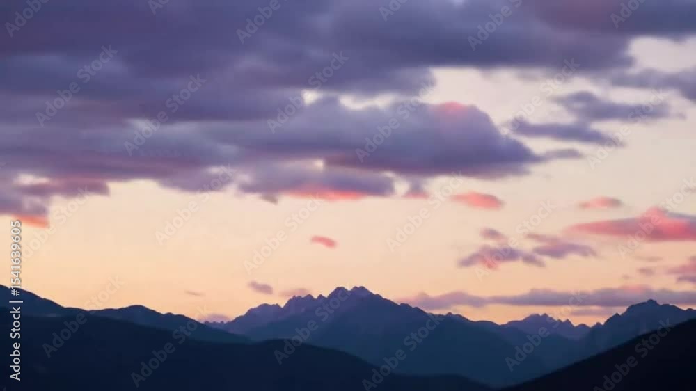 Silhouetted mountain range at sunset Silhouetted mountain range at sunset