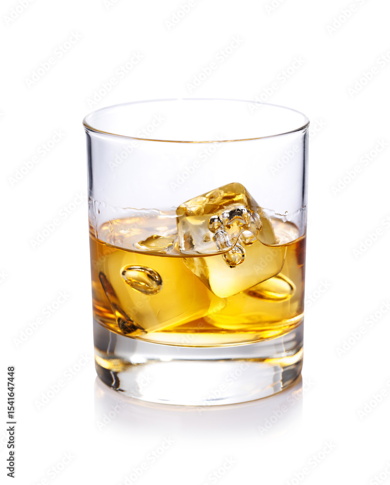 A classic whiskey glass filled with golden amber whiskey A classic whiskey glass filled with golden amber whiskey