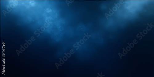 Blue light rays illuminate the night sky with a smoky blue cloudscape backdrop