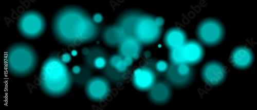 Blue blurred bokeh particles with varying size and opacity on black background. Abstract design element for festive or sci-fi scenes.
