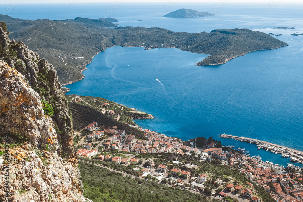Obraz premium Mindful solo traveler enjoys peaceful mountain view by the sea.Eco lifestyle, sustainable travel, unplugged digital detox, solar energy,Gen Z values,mental wellness, slow living, connection nature.