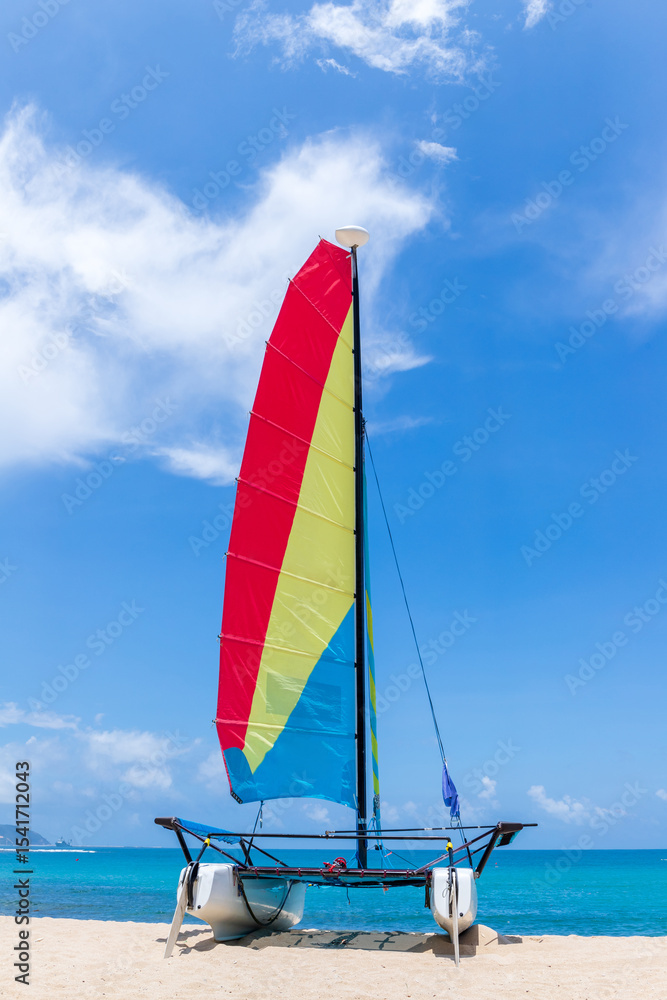 Naklejka premium A catamaran on the beach by the sea in Sanya, Hainan, China