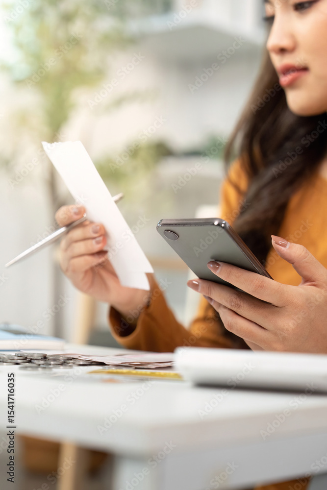 Financial Organization. Person holding smartphone and bills, managing expenses. Financial Organization. Person holding smartphone and bills, managing expenses.