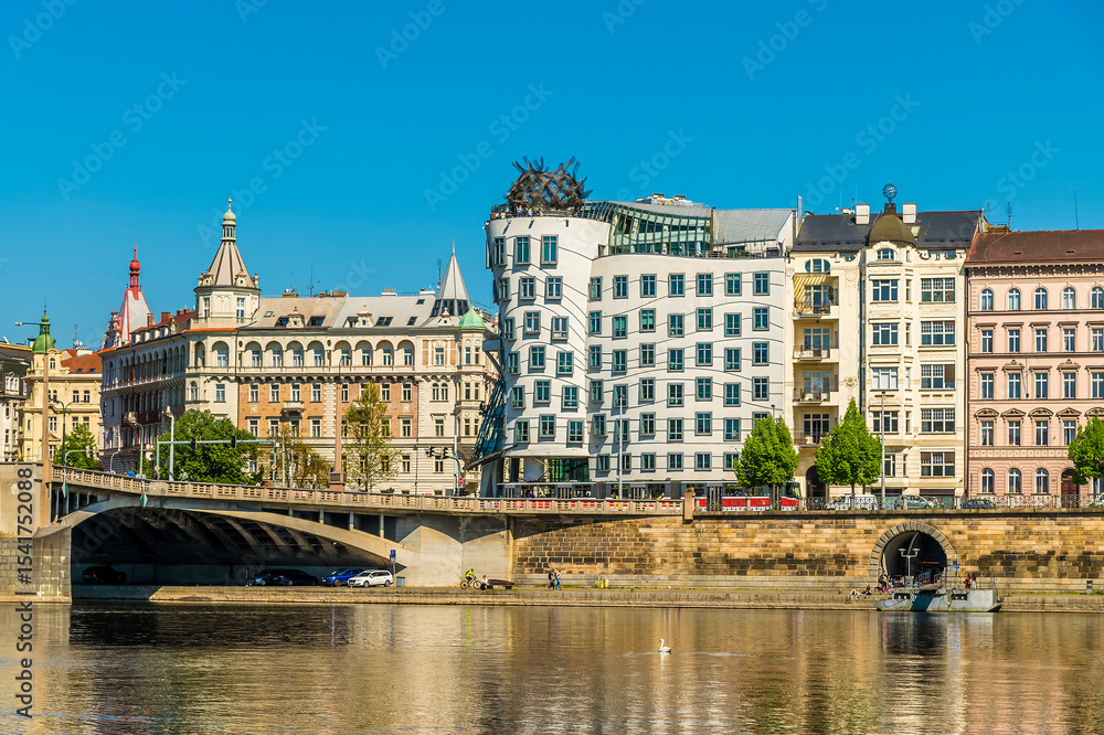 Naklejka premium A view from the Vltava river towards the east bank and the Jirasek Bridge in Prague in springtime
