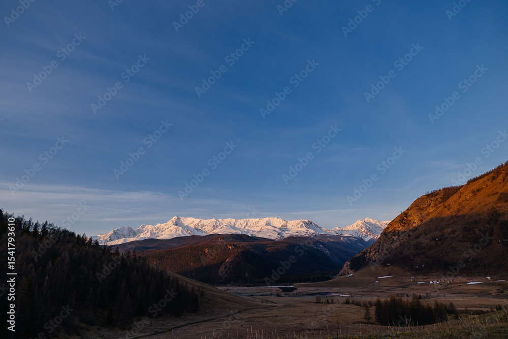 Fototapeta premium Snow-capped mountains at sunset in Altai Siberia scenic landscape