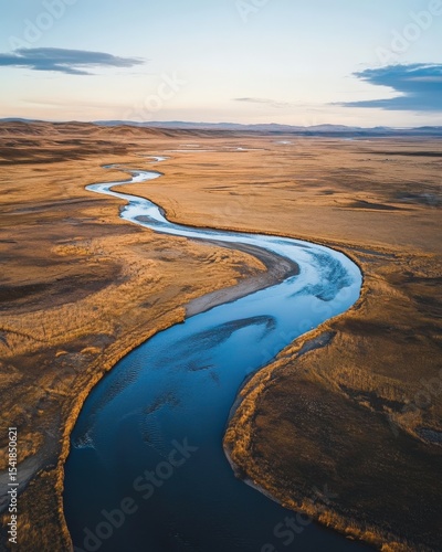 Overhead shot of winding rivers carving through the plains