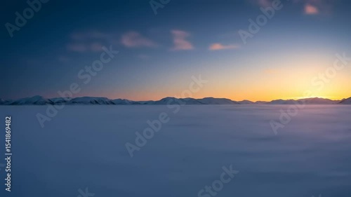Wallpaper Mural Serene winter landscape at sunset with snow-covered plains and distant mountains under a clear sky Torontodigital.ca