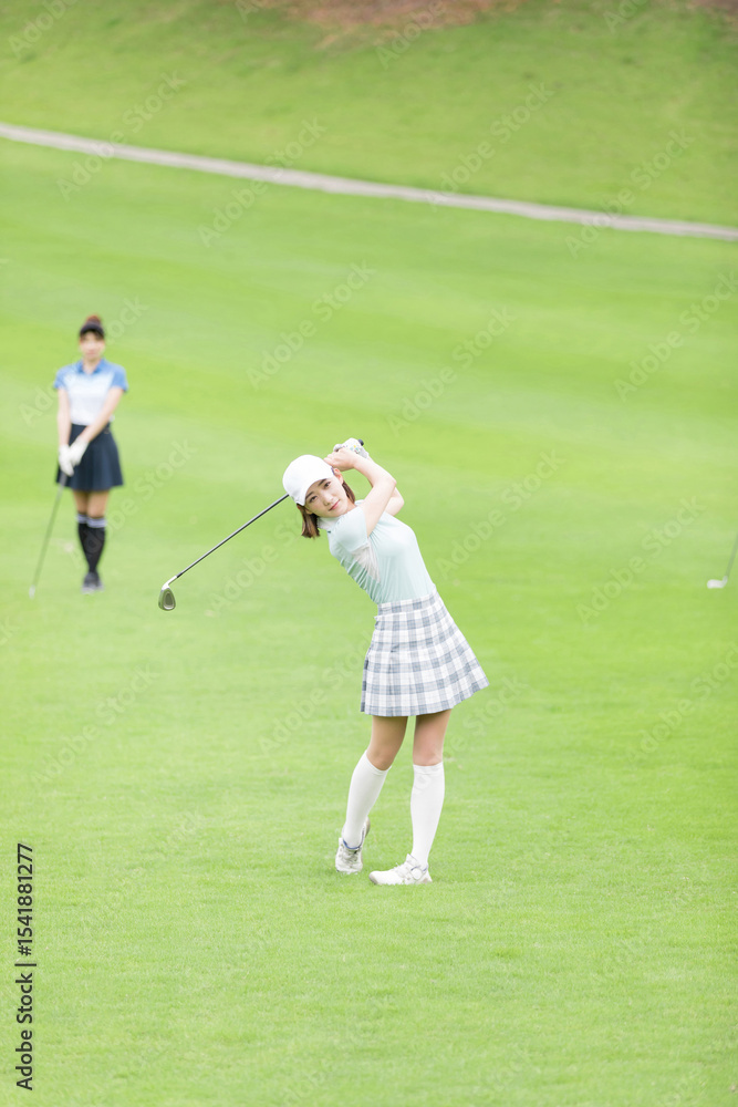 Obraz premium ゴルフを楽しむ女性