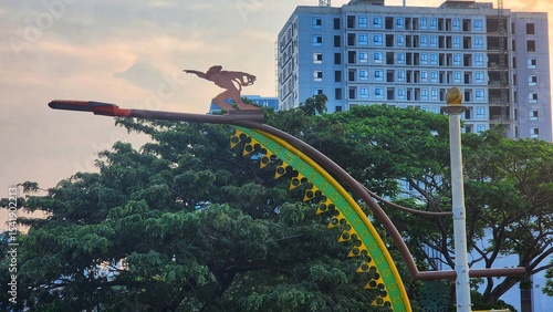 The image shows the Dirgantara Monument, also known as Tugu Pancoran or the Pancoran Statue, located in Jakarta, Indonesia. 