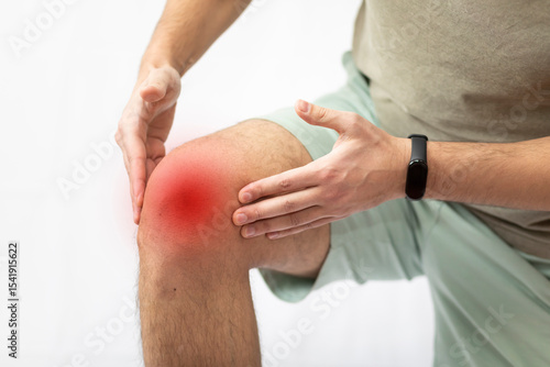 The man grabbed his knee due to severe pain	