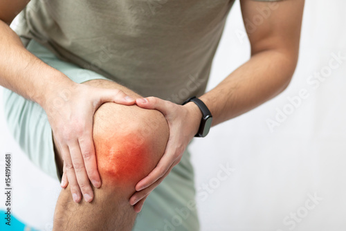 The man grabbed his knee due to severe pain	