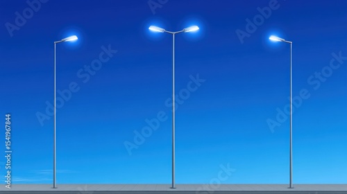 Three illuminated street lamps against a vivid blue daytime sky