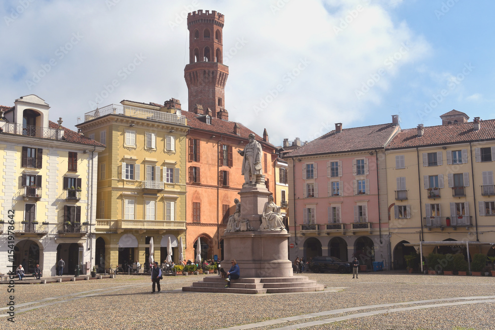 Fototapeta premium Piazza Cavour is the most important square in Vercelli. It is famous for the statue dedicated to Cavour, the trompe l'oeil of its ancient buildings, and the stone floor.