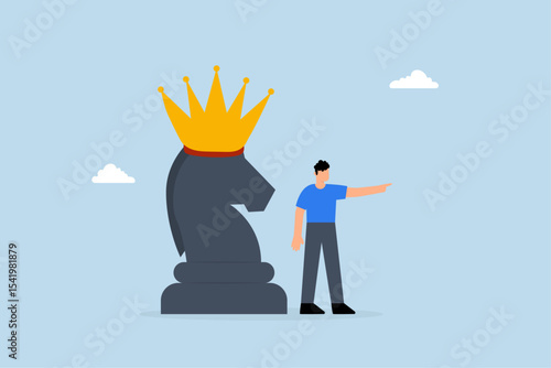 businessman pointing finger to direct with chess knight with royal crown.