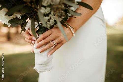 hands holding a bouquet
