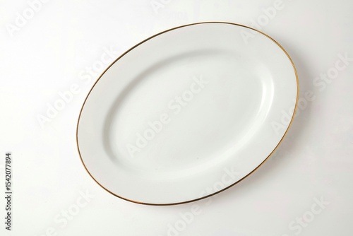 White oval ceramic plate on white background