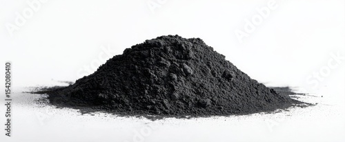 The heap of fine black powder on a clean white background.