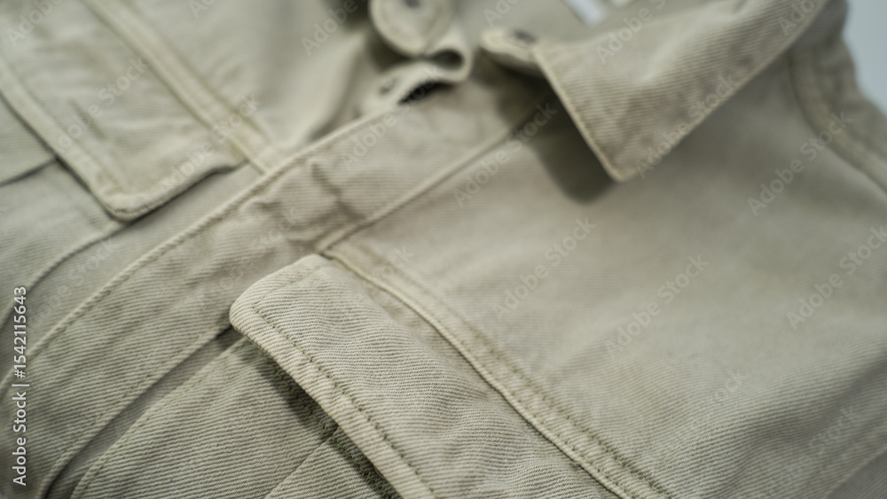 Khaki Green Utility Shirt with Flap Pockets – Close-up Fabric Texture Khaki Green Utility Shirt with Flap Pockets – Close-up Fabric Texture