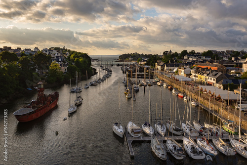 “Sunset over Port‑Rhu marina in Douarnenez, Brittany, with traditional boats and Port‑Musée in view”