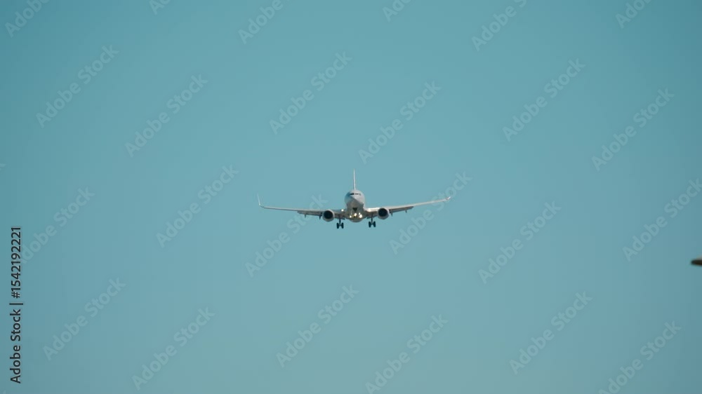 Plane prepare to landing at airport at sunny bright day time. Slow motion zoom footage Plane prepare to landing at airport at sunny bright day time. Slow motion zoom footage