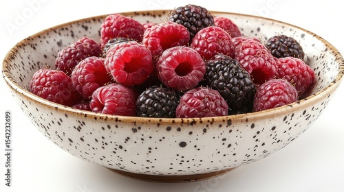 Fresh raspberries and blackberries in a bowl