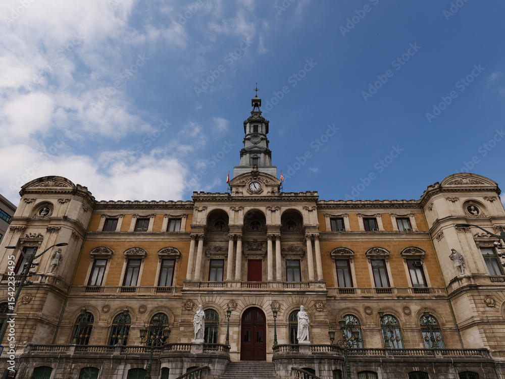 Fototapeta premium Bilbao Spain 16 06 2025 Bilbao City Hall building seen from the riverside. A historic architectural landmark reflecting the city's civic pride and cultural heritage.