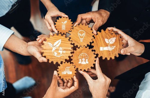 Collaborative Hands Uniting for Sustainable Business Practices Featuring Eco-Friendly Icons on Wooden Gears Representing Green Solutions and Innovations. Amity