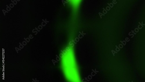Abstract blurred neon green light motion wave background.