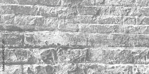 Abstract pattern created by the repetition of blocks or bricks on an old wall, inviting contemplation of form.
