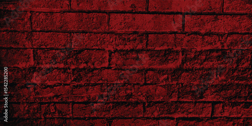 Red-scale image of a building exterior, highlighting intricate patterns and shadows cast on its textured walls.
